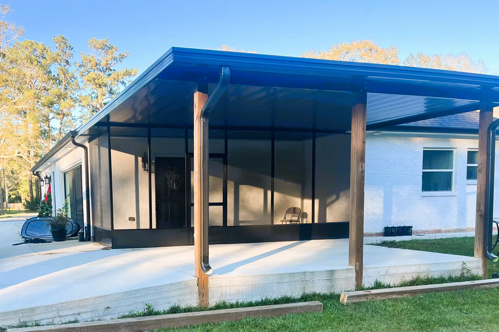 black patio cover with wood beams