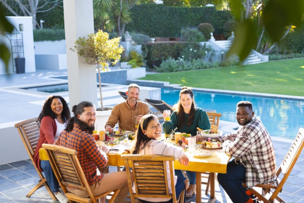 Friends enjoying a meal on a patio