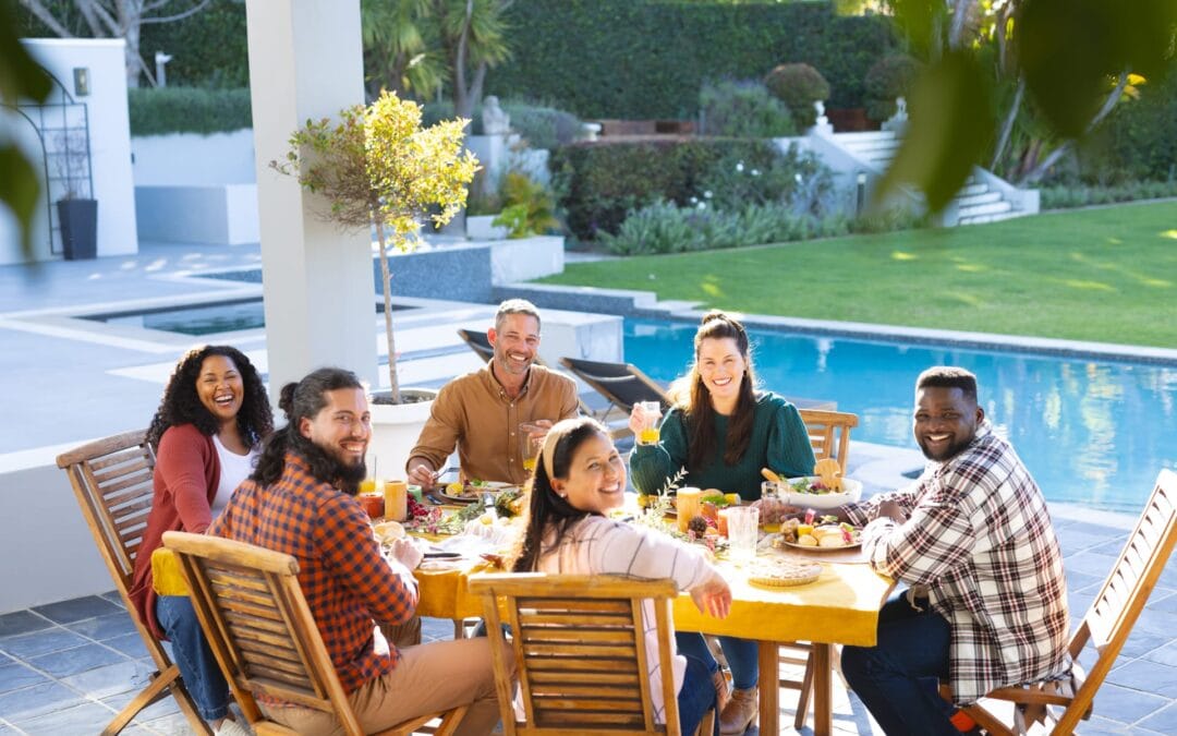 Friends enjoying a meal on a patio